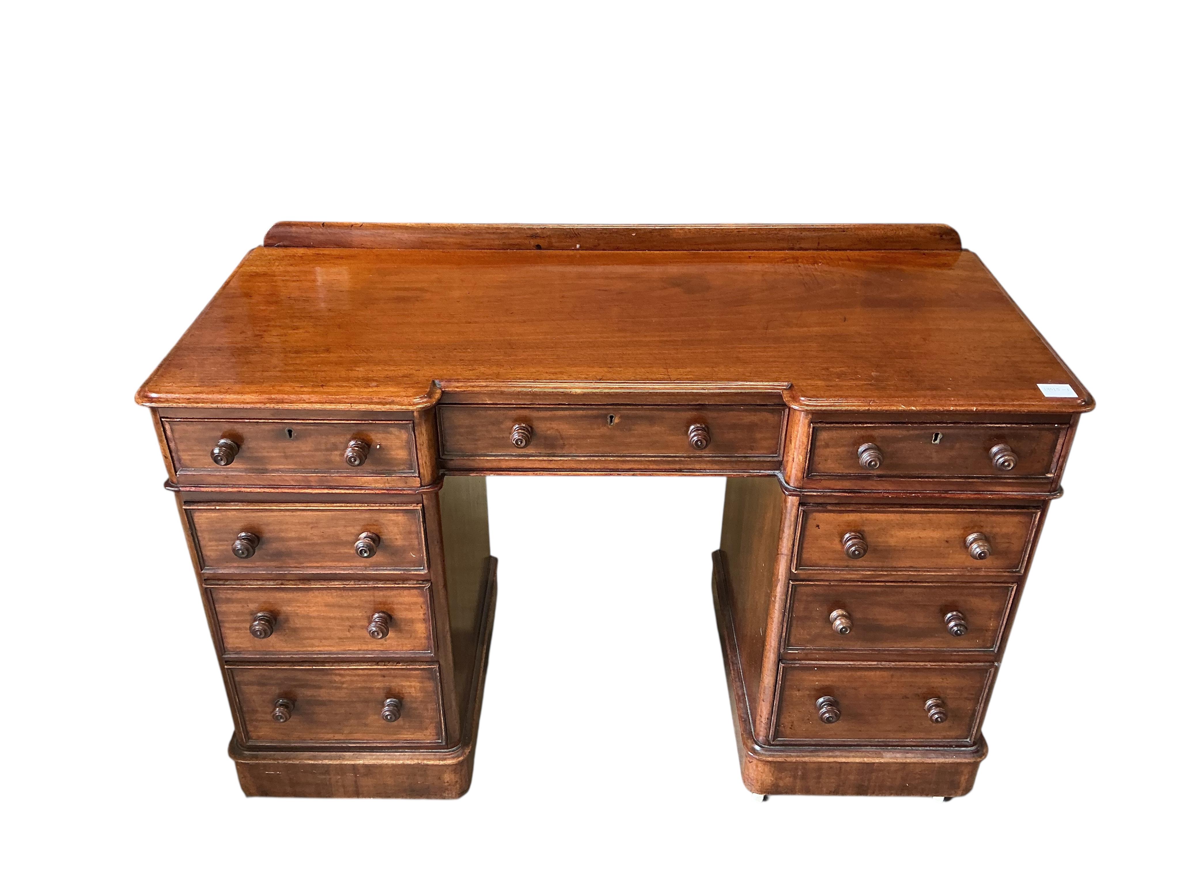 A Victorian mahogany inverse breakfront pedestal dressing table, width 120cm, depth 52cm, height 80cm